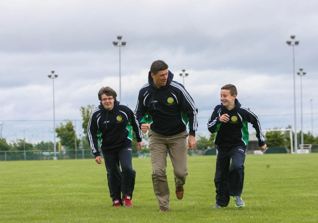 Team members Eoin Hurley and Oisin O'Gorman with Niall Quinn.